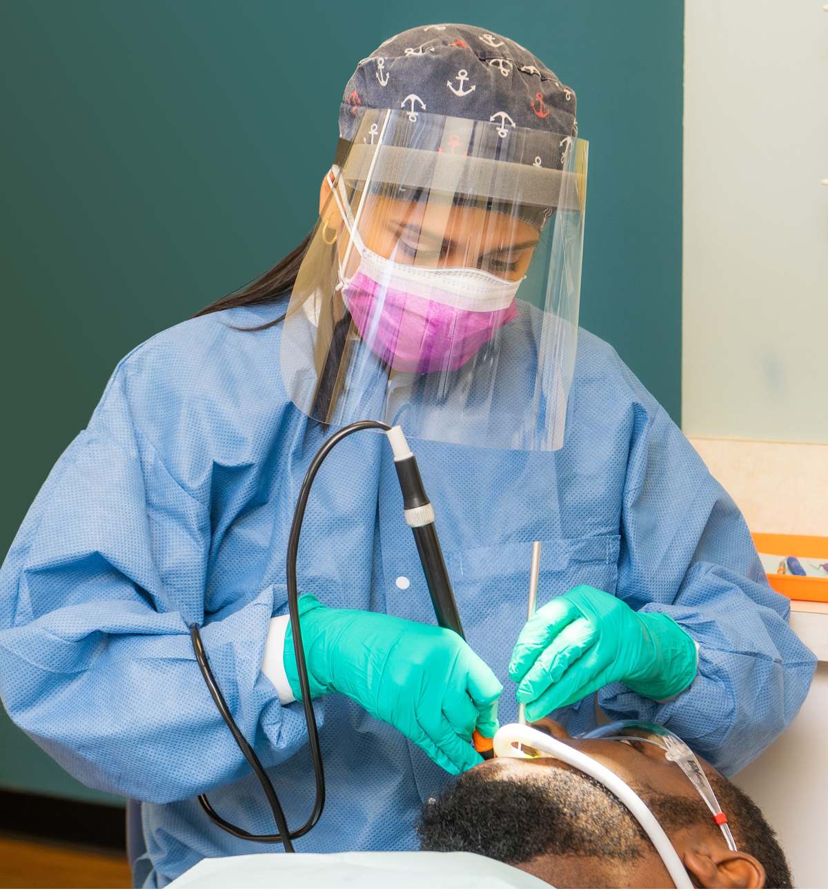 Dental Hygeinist Dental Hygeinist working on patient